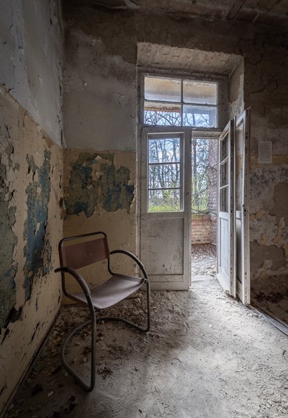 Tubular steel chair by the balcony door