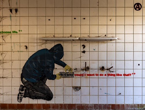 Hooded figure in the washroom