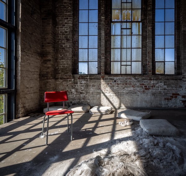 Red chair beneath the windows