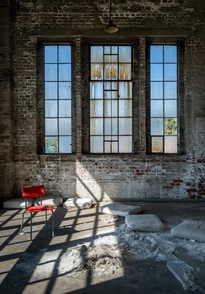 Window light and a red chair