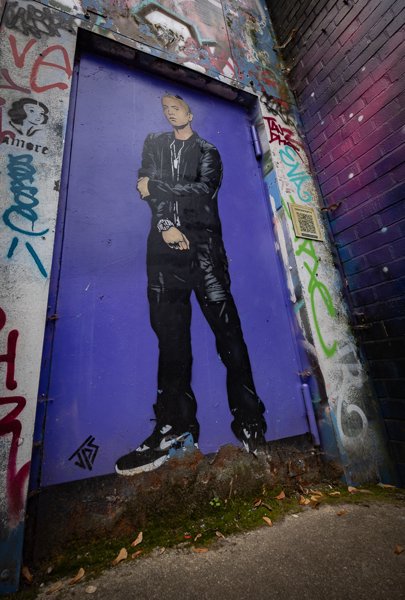 Figure on a purple door